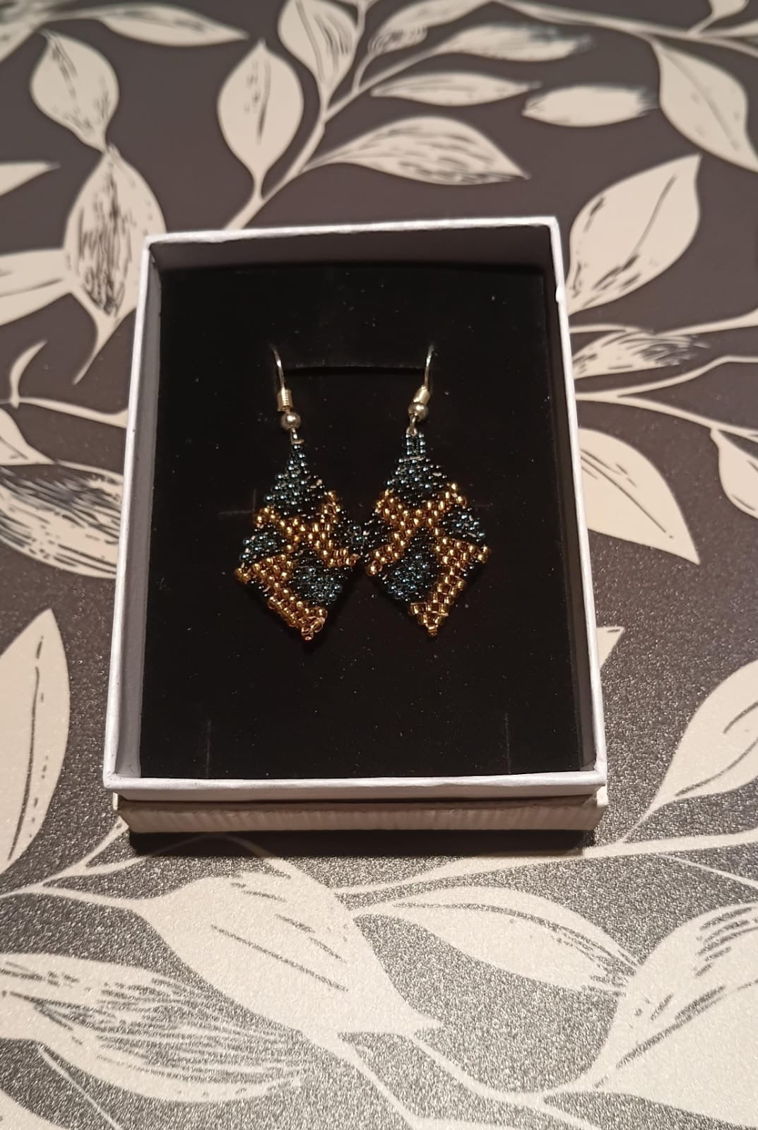 Bronze Eclipse handmade African beaded earrings in teal and bronze-gold